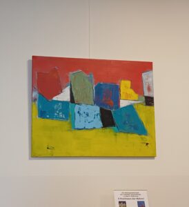 Abstraktes Acrylbild in den Farben rot, blau, gelb und weiß. es sind im weitesten Sinne Bauklötzchen zu sehen.